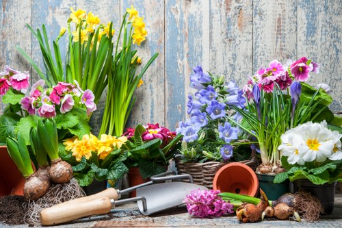 Operative wearing PPE while handling gardening equipment